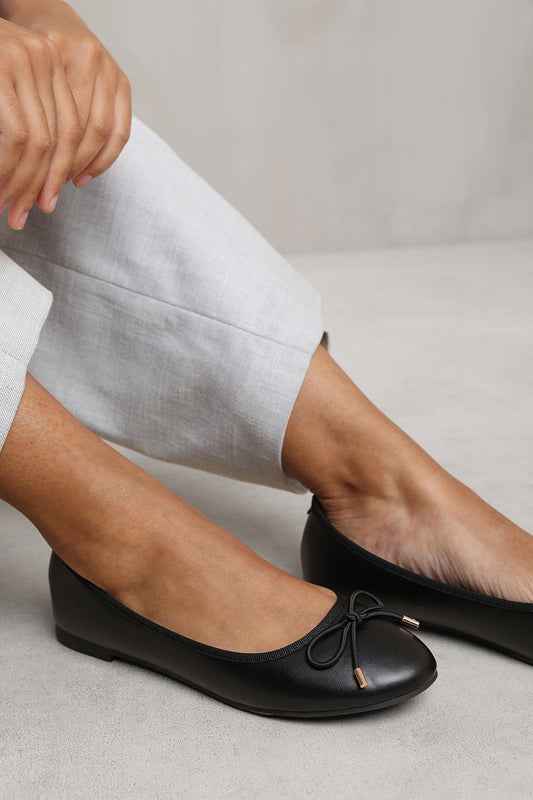 BEXLEY SLIP ON FLAT PUMPS IN BLACK FAUX LEATHER