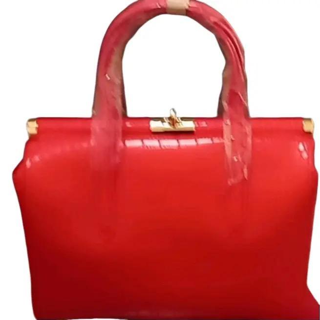 Biface rigid crocodile effect handbag