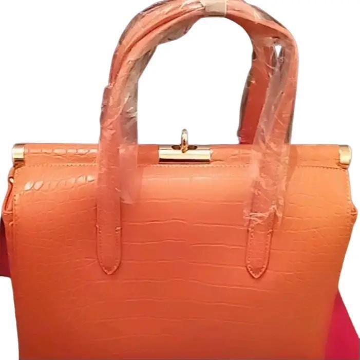 Biface rigid crocodile effect handbag