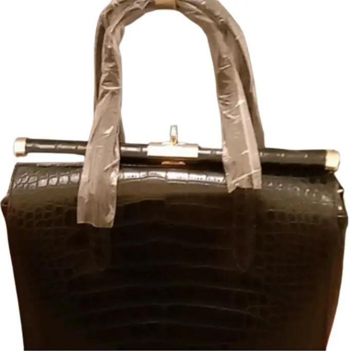 Biface rigid crocodile effect handbag