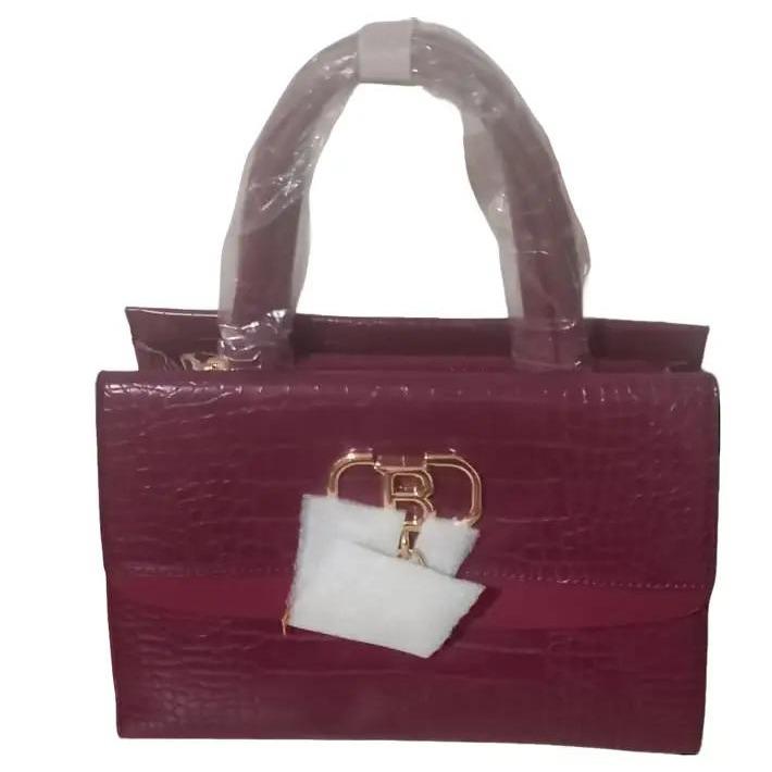 Crocodile effect handbag with flap and golden fringe